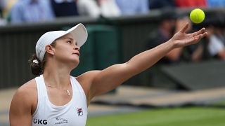 Australia's Ashleigh Barty serves to Czech Republic's Karolina Pliskova during the women's singles final match of the Wimbledon Tennis Championships in London, July 10, 2021. 