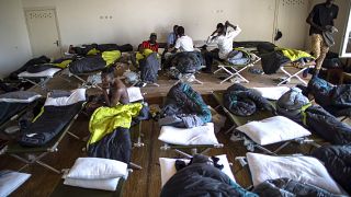 Migrants from Cameroon rest at the refugee camp in the village of Vydeniai, Lithuania, Saturday, July 10, 2021. 