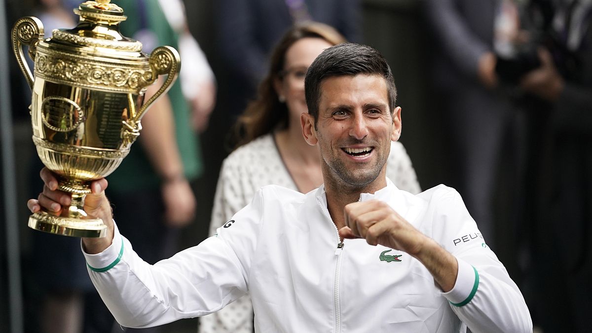 Serbia's Novak Djokovic holds the winner's trophy