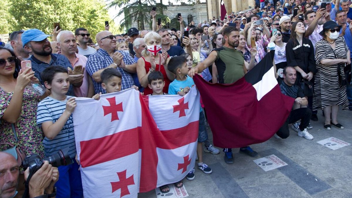 Opponents of the march block off the capital's main avenue to an LGBT march in Tbilisi, Georgia, Monday, July 5, 2021.