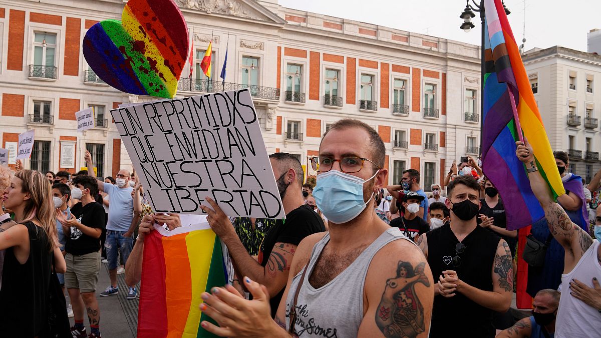 People protest after a spike in attacks on LGBTQ people, Madrid, Spain, Sunday, July 11, 2021.