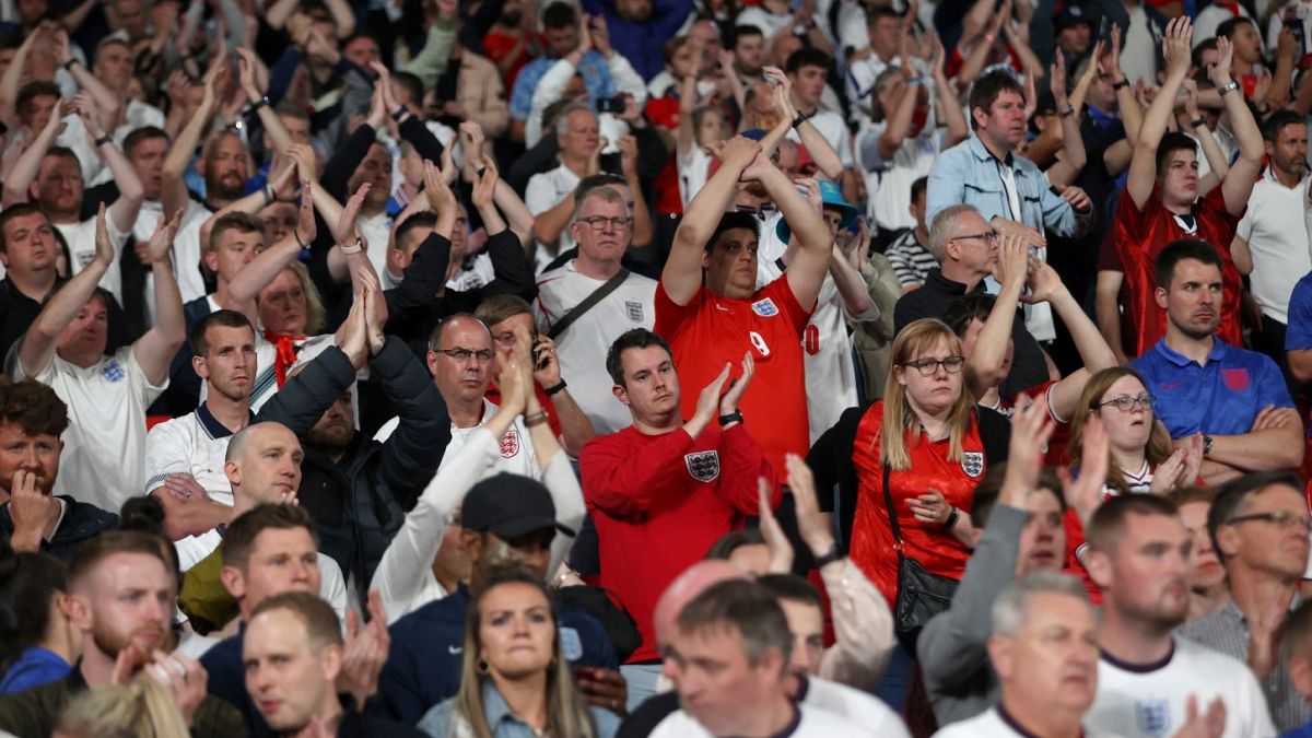England supporters applaud their team after Sunday's final at Wembley Stadium.