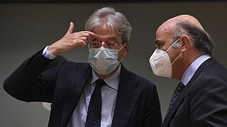 EU commissioner for Economy Paolo Gentiloni talks with European Central Bank Vice-President Luis de Guindos during a Ecofin Council
