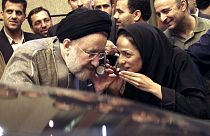 FILE - In this July 13, 2005, file photo, outgoing reformist Iranian President Mohammad Khatami talks on the phone with the mother of female journalist Masih Alinejad, right.
