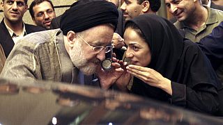 FILE - In this July 13, 2005, file photo, outgoing reformist Iranian President Mohammad Khatami talks on the phone with the mother of female journalist Masih Alinejad, right.