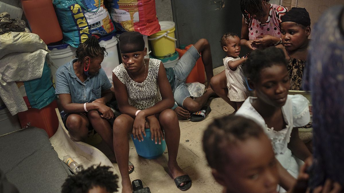 A school turned shelter hosts families displaced by gang violence in Port-au-Prince, Haiti, Tuesday, July 13, 2021.
