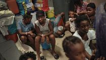 A school turned shelter hosts families displaced by gang violence in Port-au-Prince, Haiti, Tuesday, July 13, 2021.