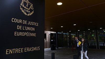 People walk away from the entrance of the European Court of Justice in Luxembourg