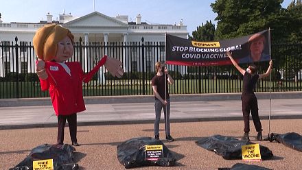 Activists protest outside White House as Biden hosts Merkel
