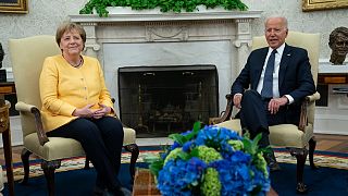 President Joe Biden meets with German Chancellor Angela Merkel in the Oval Office of the White House, Thursday, July 15, 2021, in Washington.