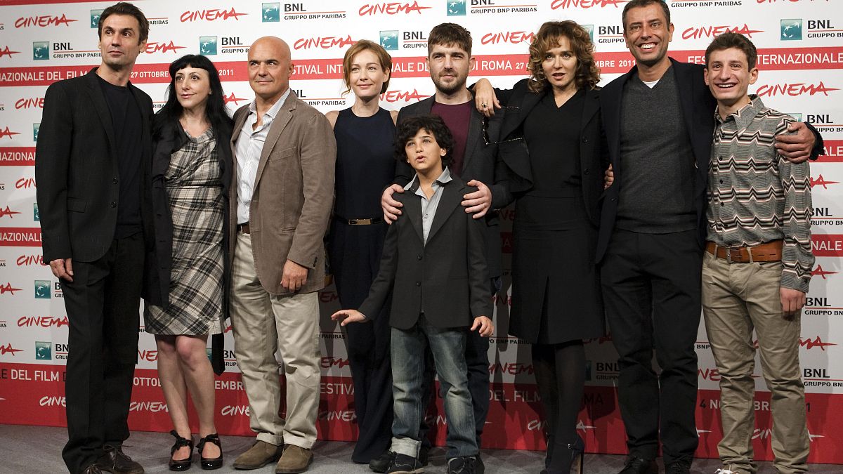 Roma, novembre 2011: De Rienzo, al centro della foto, durante la presentazione di "La Kryptonite nella borsa" al Rome international film festival
