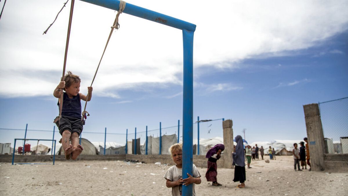 FILE: Children play at al-Hol camp that houses some 60,000 people, including families and supporters of the Islamic State group, Syria, Saturday, May 1, 2021. 