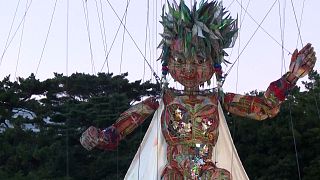 10-metre tall puppet Mocco being raised by a crane