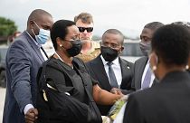 Haiti's first lady Martine Moise, wearing a bullet proof vest and her right arm in a sling, arrives in Port-au-Prince, Haiti, Saturday, July 17, 2021.