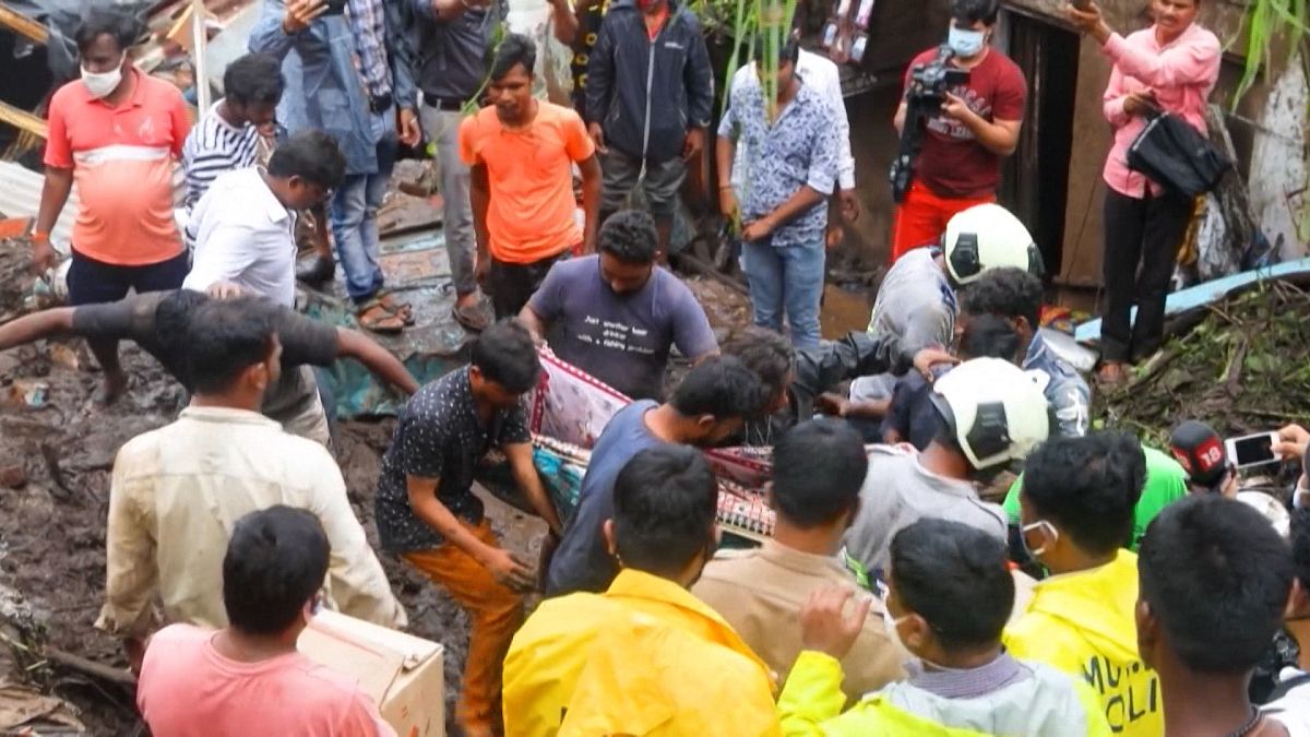 Rescue workers pull out a victim 