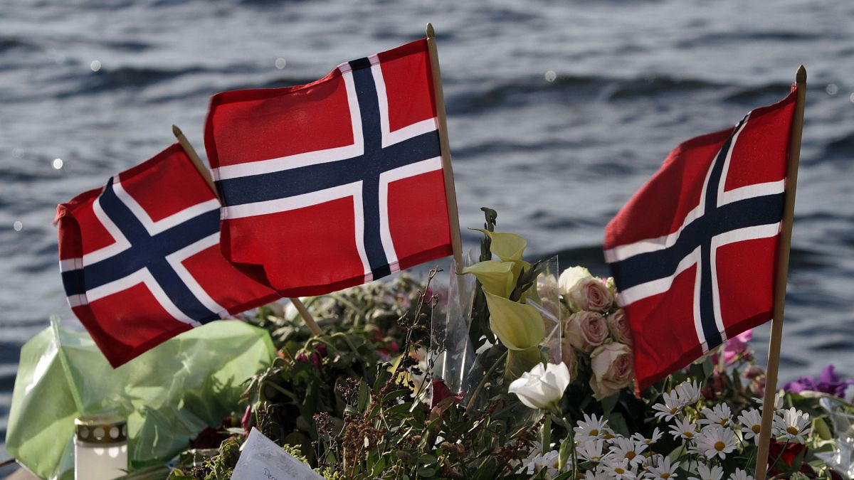 Norwegian flags and flowers are laid in Sundvollen, close to Utoya island in 2011.