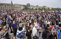 Anti-vaccine protesters march during a rally in Paris, Saturday, July 17, 2021.
