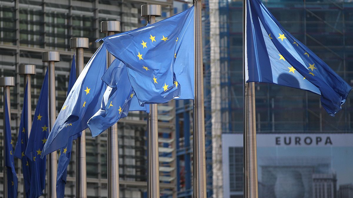 FILE: European Union flags wave in the wind outside EU headquarters in Brussels. 