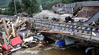 Debris piled up next to a bridge after the flood  in Pepinster, Belgium