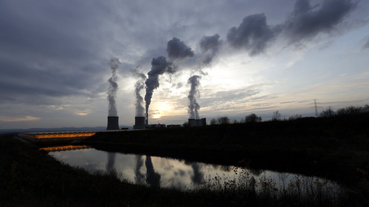 Smoke rises from chimneys of the Turow power plant near the town of Bogatynia, Poland.