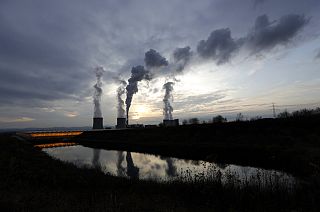Smoke rises from chimneys of the Turow power plant near the town of Bogatynia, Poland.