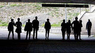 Asylum seeker children pose under a railway bridge in Flen, about 100km south of Stockholm, in August 2018.