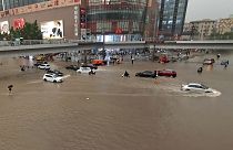 Vehicles are stranded after a heavy downpour in Zhengzhou city, central China