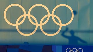 A Germany player is silhouetted against a wall during a Beach Volleyball training session ahead of the 2020 Summer Olympics, Tuesday, July 20, 2021, in Tokyo.