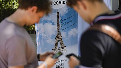 Visitors register for COVID-19 tests at the Eiffel Tower in Paris, Wednesday, July 21, 2021. Visitors register for COVID-19 tests at the Eiffel Tower in Paris, Wednesday, July 21, 2021.