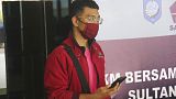 A man who used a fake identity arrives at the Sultan Babullah airport in Ternate, Indonesia.
