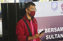 A man who used a fake identity arrives at the Sultan Babullah airport in Ternate, Indonesia.