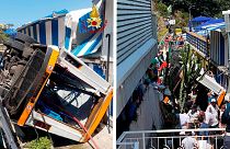 Rescuers work on the site where a bus crashed in Capri.