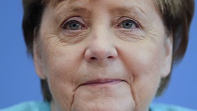 Angela Merkel német kancellár mosolyog utolsó nyári sajtótájékoztatóján 2021. július 22-én