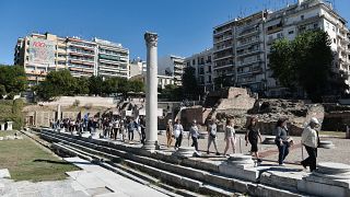 People in Thessaloniki protest against the removal and repositioning of antiquities found during the construction of the Venizelos Metro Station.