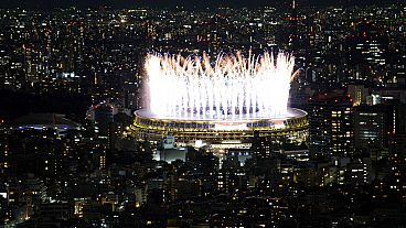 Fireworks illuminate over National Stadium during the opening ceremony of 2020 Tokyo Olympics, July 23, 2021, in Tokyo. 