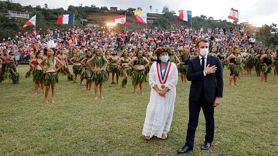 France's President Emmanuel Macron and Hiva Oa Mayor Joëlle Frebault attend a welcoming ceremony in French Polynesia