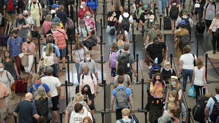 Travellers queue at security checkpoint, Denver International Airport, 16 June 2021