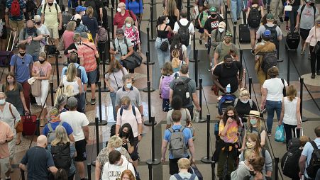 Travellers queue at security checkpoint, Denver International Airport, 16 June 2021