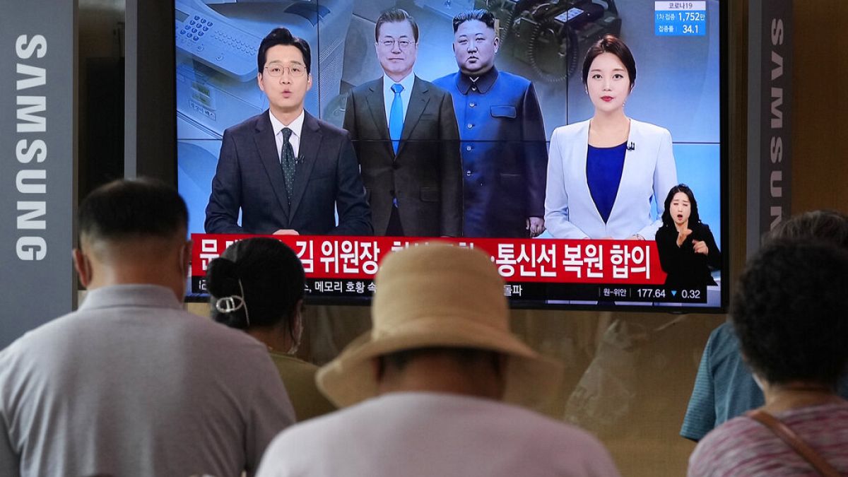 A news program at the Seoul Railway Station in Seoul, South Korea, Tuesday, July 27, 2021. 