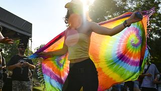 A woman dances during a gay pride parade in Budapest in July.