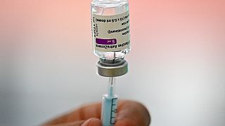 A health worker prepares a dose of the AstraZeneca/Oxford vaccine at a coronavirus vaccination centre in Madrid