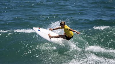 Tsurigasaki Surfing Beach: France's Pauline Ado rides a wave during women's Surfing at Tokyo 2020