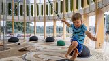 Four-year-old Felek plays in an AirBubble, an innovative playground providing clean air thanks to algae.