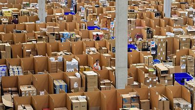 Amazon warehouse workers collect goods for thousands of purchase orders containing unrecyclable plastic Amazon warehouse workers collect goods for thousands of purchase orders containing unrecyclable plastic