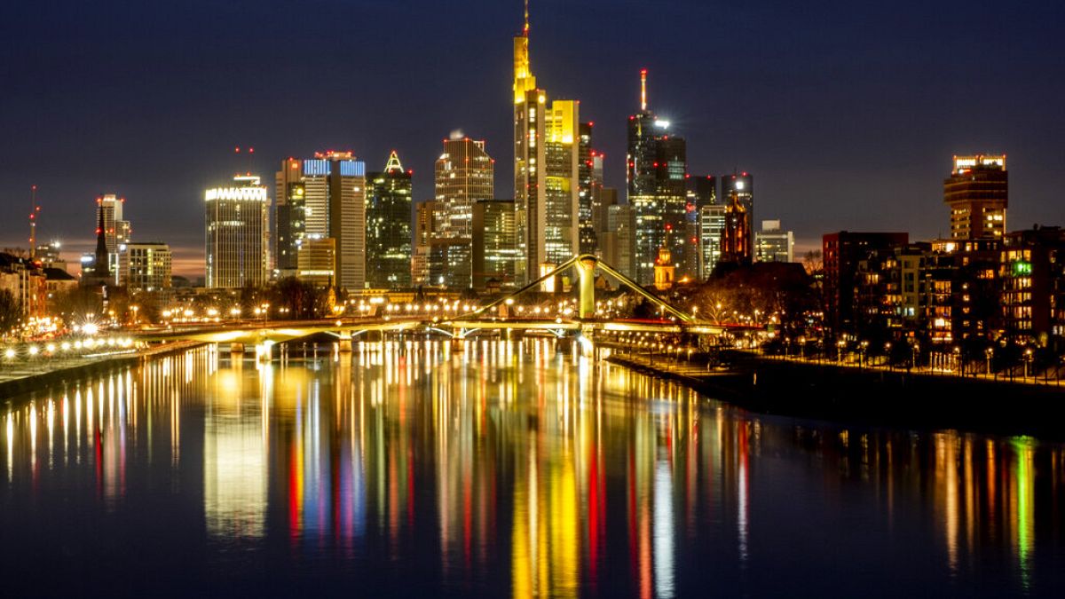 The lights of the bridges and buildings are reflected in the river Main in Frankfurt, Germany. Europe’s economy has rebounded into growth in the second quarter of 2021