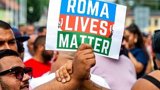 People hold a banner "Roma Lives Matter" during a rally to honor a Roma man Stanislav Tomas who died after police officers held him in Teplice, Czech Republic, June 26.