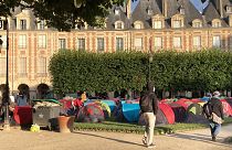 Homleless people in tents on the Place des Vosges in Paris on the morning of July 30, 2021.