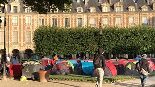 Homleless people in tents on the Place des Vosges in Paris on the morning of July 30, 2021.