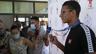 Heroic welcome for Tunisia's 18 year old Olympic king Ahmed Hafnaoui