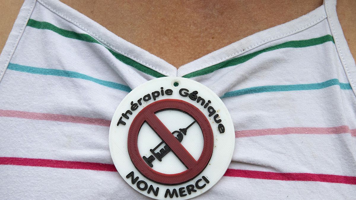 Someone takes part in an anti-vaccine rally in France.